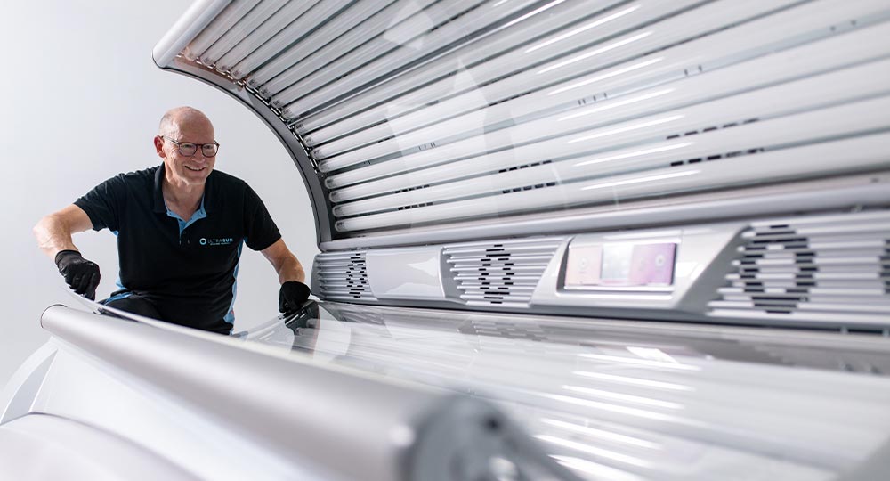 Man working on a white sunbed