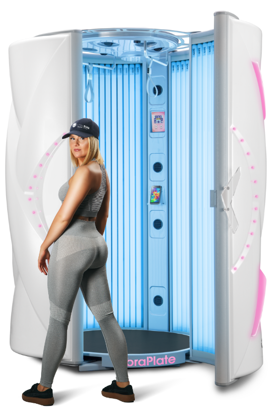 Woman wearing sports clothes standing in front of a sunbed