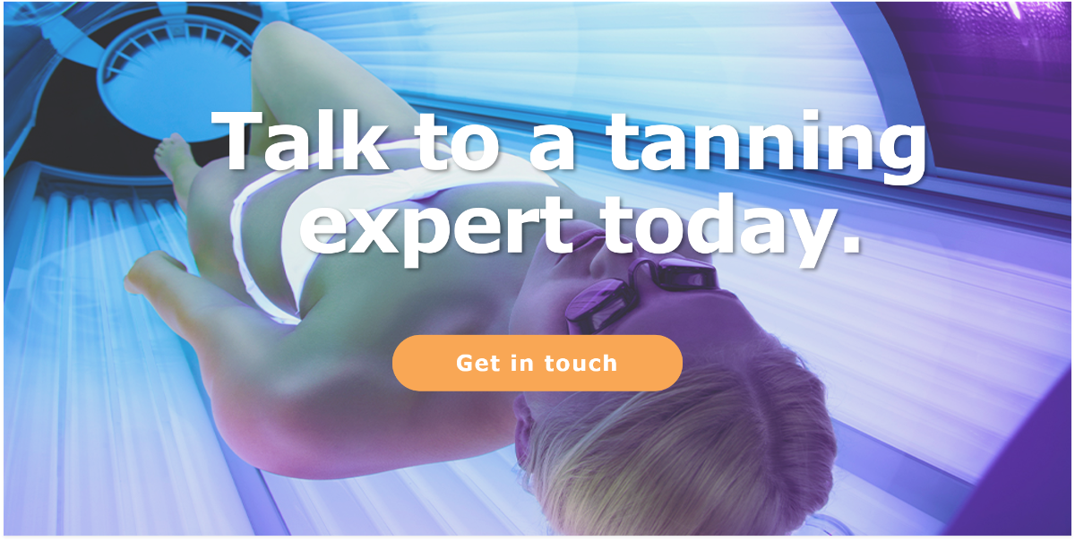 Woman lying down inside a sunbed